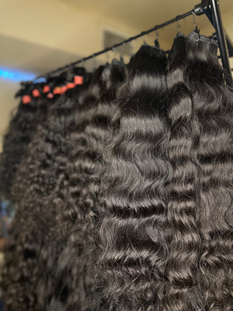 Natural Indian Hair Weft in various wave patterns, ideal for stylish extensions and versatile hairstyles
