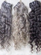 Opulent gray curly hair bundles displayed in various shades for stylish hair extensions