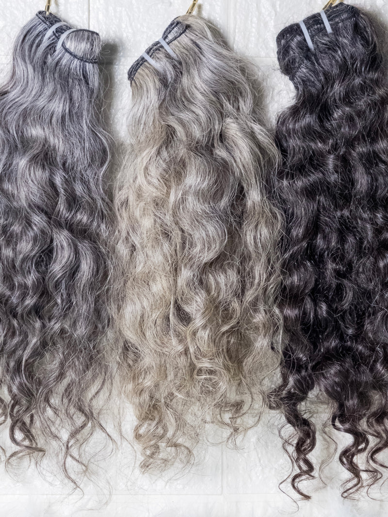 Opulent gray curly hair bundles displayed in various shades for stylish hair extensions