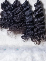 Opulent Raw Indian wavy bundles displayed in three different shades for luxurious hairstyles