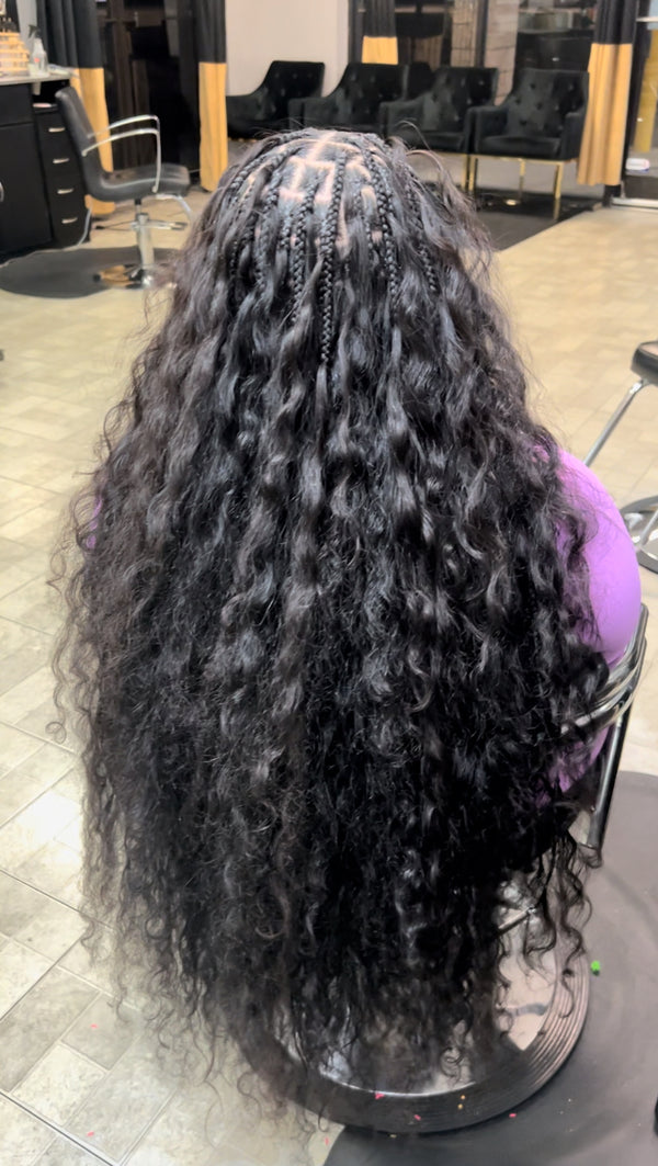 Long raw Indian curly hair bundles styled in a beautiful thick wave for a natural look