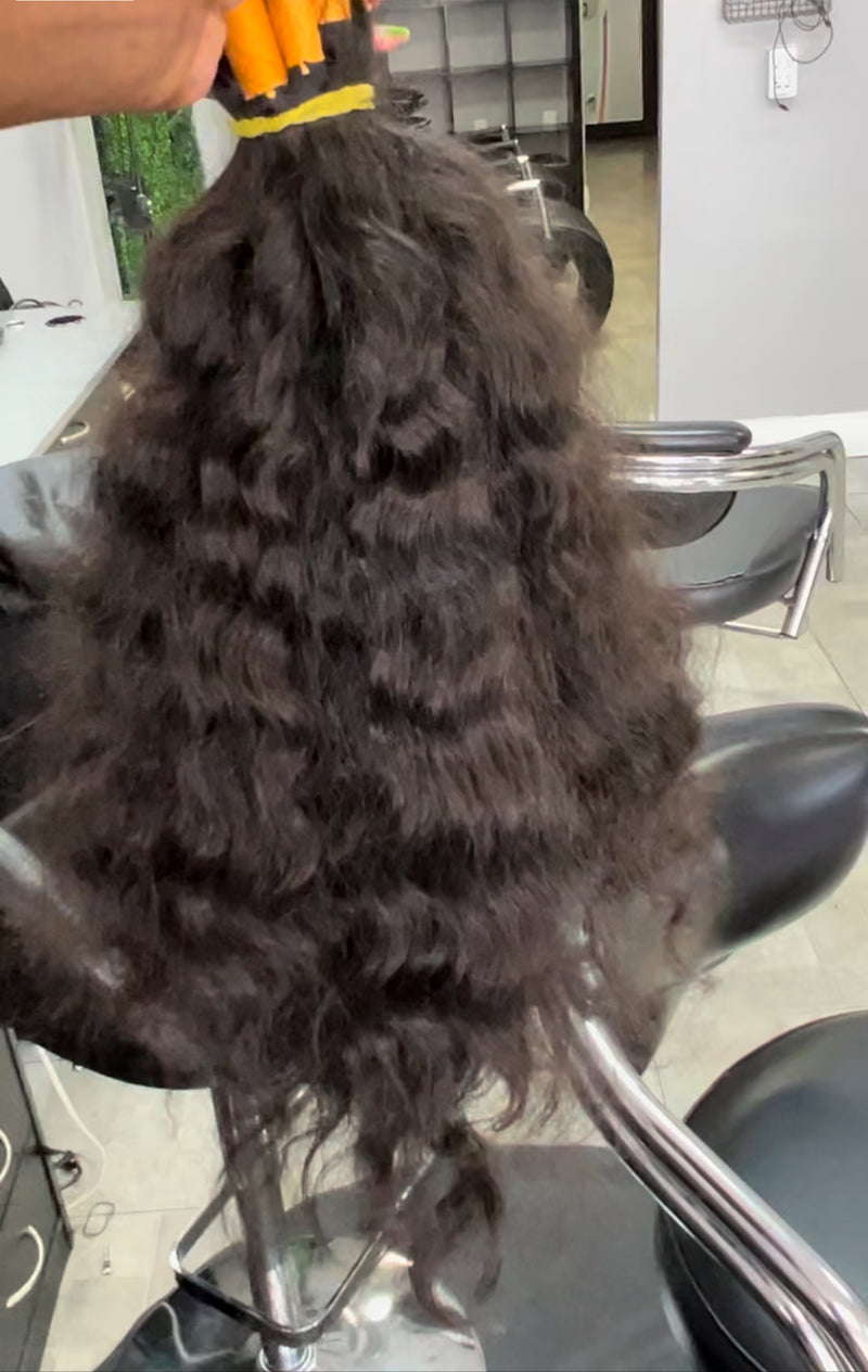 Raw Indian curly hair bundles shown with rich texture and volume for versatile styling options