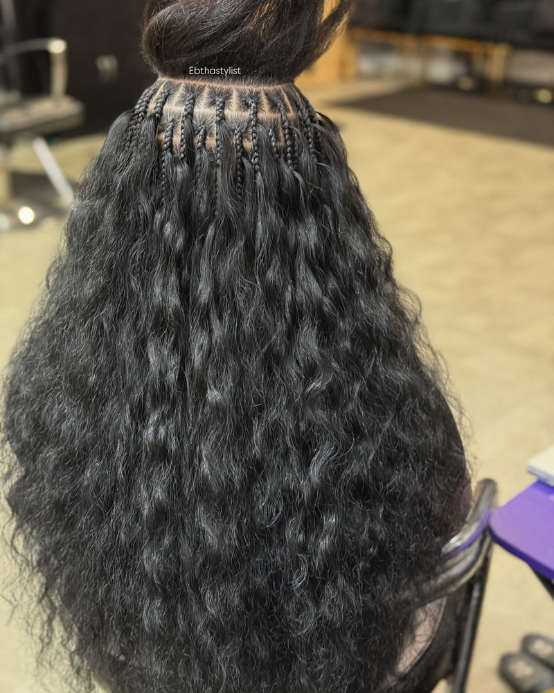 Raw Indian wavy hair styled with intricate braids for a natural look and easy maintenance
